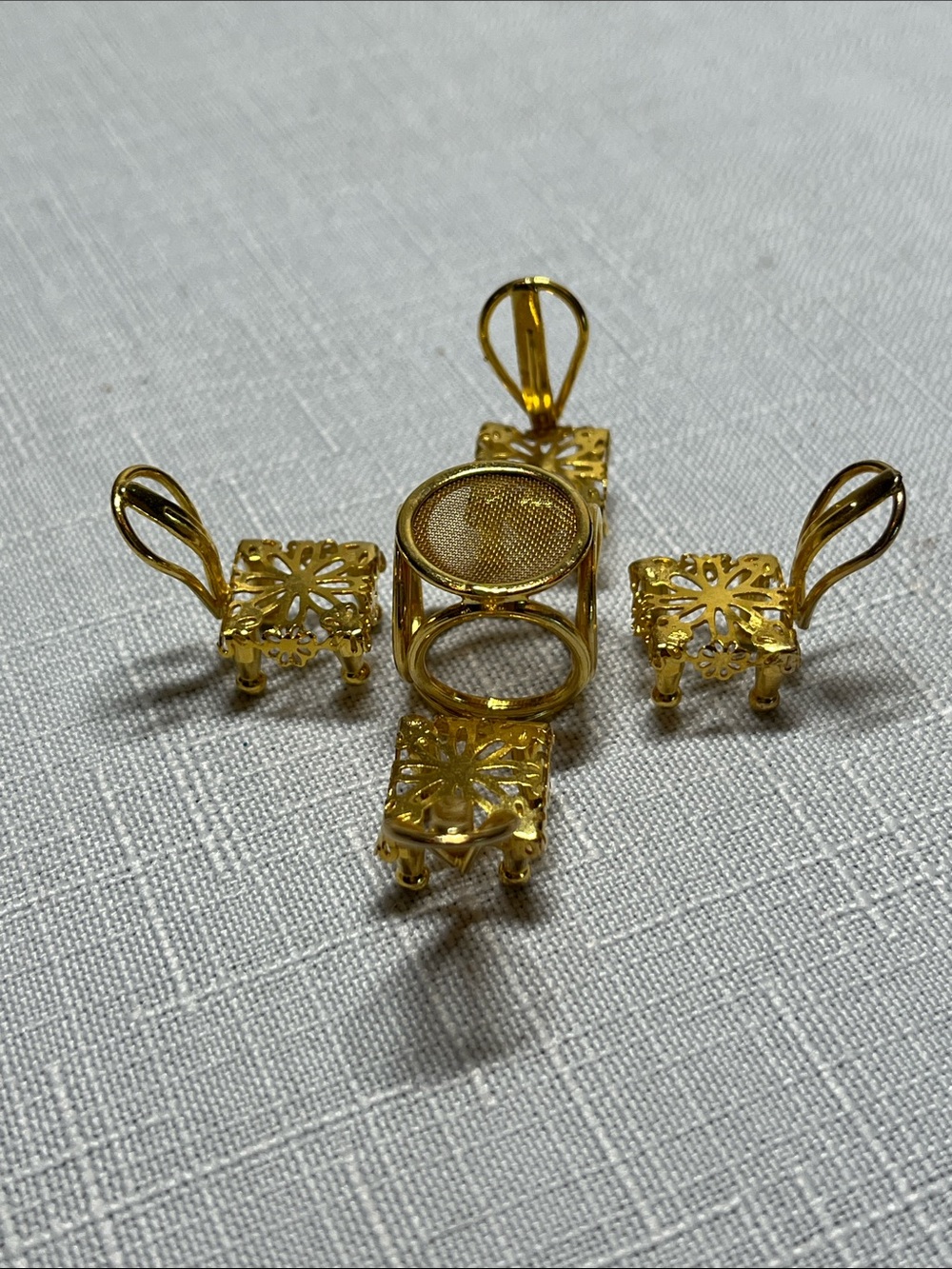 Minitiques dollhouse miniature set 
gold-plated mesh top table
four chairs